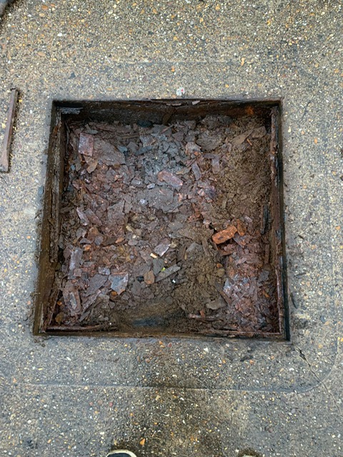 Rusting frame of manhole cover